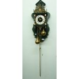 A DUTCH STYLE WALL CLOCK WITH BRASS TEAR SHAPED WEIGHTS