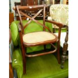 A MODERN MAHOGANY ARMCHAIR, WITH 'X' BACK, CANE SEAT, A PAD TOP STOOL, ON CABRIOLE SUPPORTS (2)