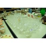 COLLECTION OF CUT AND ETCHED DRINKING GLASSES, BRANDY BALLOONS