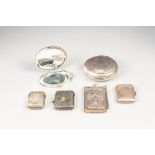 THREE SILVER PLATED VESTA CASES, A WHITE METAL DISC SHAPED TOBACCO BOX, an Aide Memoire and a LADY'S