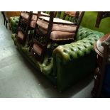 A TWO SEATER GREEN LEATHER CHESTERFIELD SETTEE