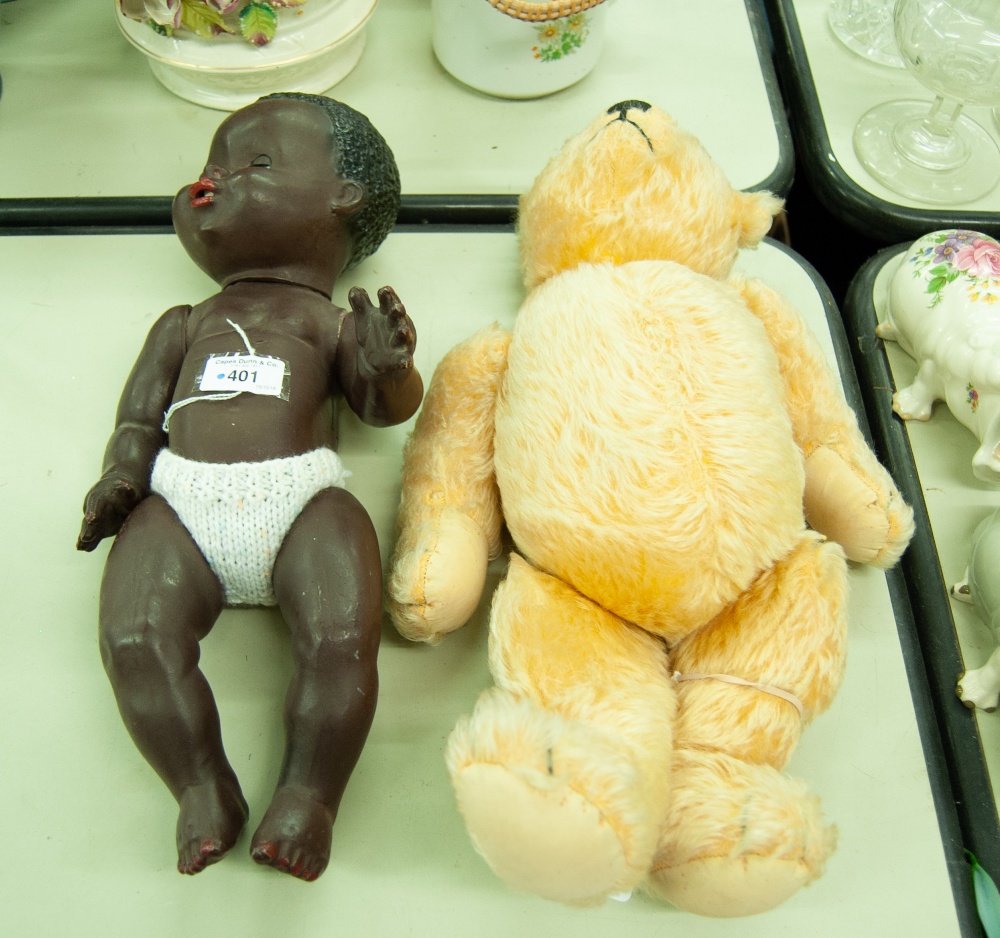 A BLACK POT DOLL AND A TEDDY BEAR (2)