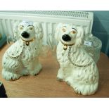 A PAIR OF TWENTIETH CENTURY BESWICK STAFFORDSHIRE STYLE POTTERY MANTEL SHELF DOGS