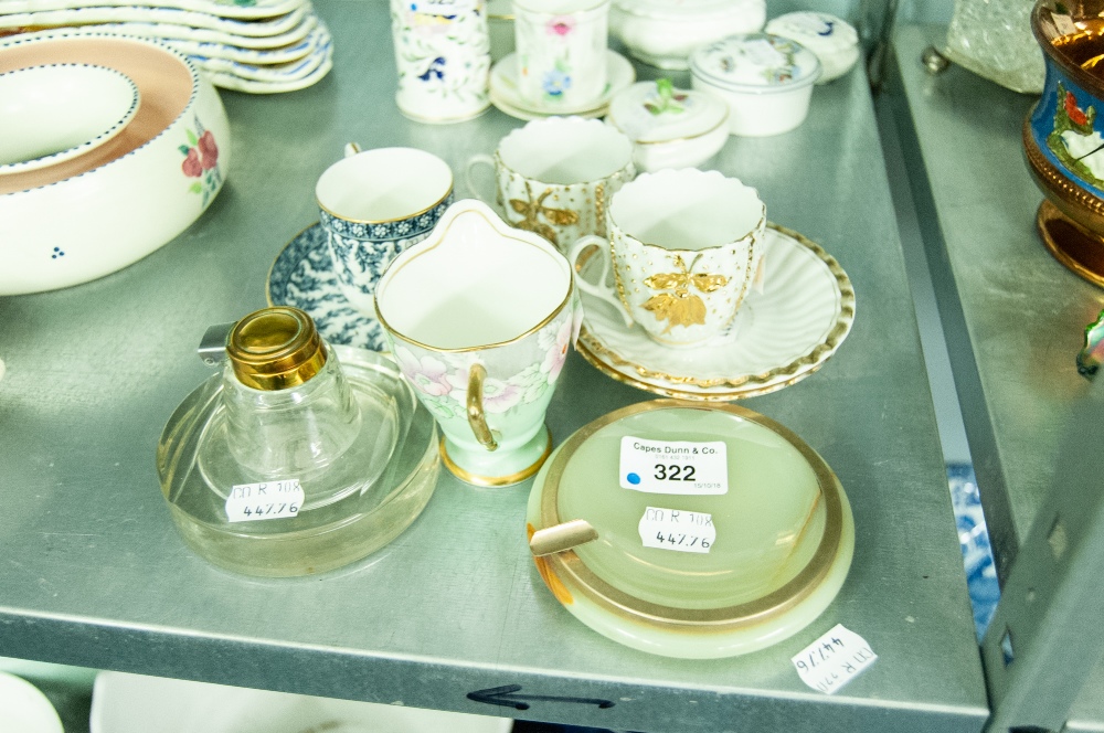 A HEAVY GLASS CIRCULAR INKWELL WITH ELECTROPLATED MOUNT AND HINGED LID, THE BROAD SIMILAR BASE