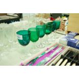 SIX LATE VICTORIAN PORT GLASSES WITH GREEN BOWLS, PLAIN DRAWN STEMS AND CUSHION KNOPS AND CIRCULAR