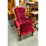 A VICTORIAN CABRIOLE LEGGED ARMCHAIR