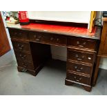 A REPRODUCTION MAHOGANY TWIN PEDESTAL DESK