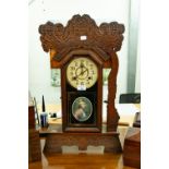 A LATE NINETEENTH CENTURY AMERICAN SHELF CLOCK, IN SCROLL CARVED CASE (A.F.)