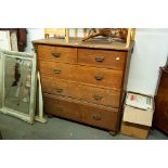 A LATE VICTORIAN OAK CHEST OF DRAWERS