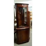 A MAHOGANY DOUBLE CORNER CUPBOARD WITH BOW FRONT