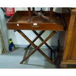 A MAHOGANY BUTLERS TRAY, on folding stand