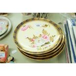 A SET OF EARLY TWENTIETH CENTURY PAINTED DESSERT PLATES WITH YELLOW GROUND AND HAND PAINTED FLOWERS,