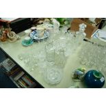 A COLLECTION OF CUT GLASS AND CRYSTAL GLASSES, VASES, DECANTERS, GRAPEFRUIT BOWLS ETC.....