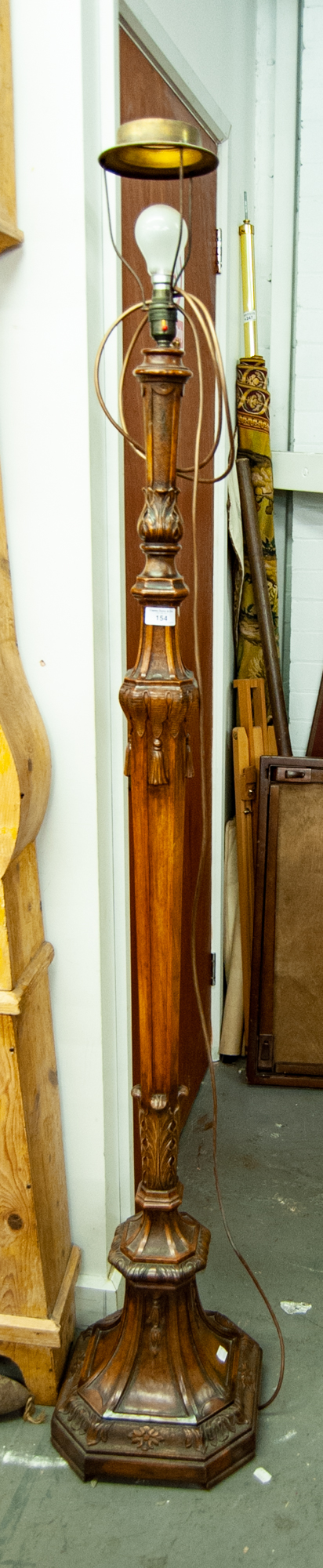 AN EARLY TWENTIETH CENTURY CARVED WALNUT ELECTRIC LAMP STANDARD OF GEORGIAN REVIVAL STYLE