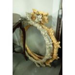 TWO GILT CAST RESIN CIRCULAR MIRROR FRAMES 'ENGLISH OAK' AND ONE FINISHED IN GREY (3)