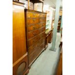 A REPRODUCTION QUEEN ANNE STYLE WALNUT CHEST OF FOUR SMALL AND FIVE LONG DRAWERS, FEATHER BANDED, ON