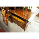 AN EARLY TWENTIETH CENTURY OAK MONKS BENCH WITH HINGE SEAT