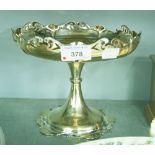 AN ELECTROPLATE TALL PEDESTAL FRUIT BOWL WITH SHAPED AND PIERCED BORDER