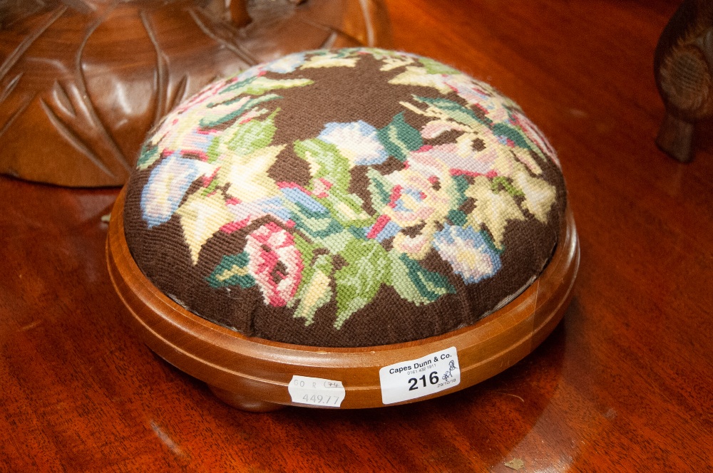 A MODERN MAHOGANY CIRCUALR TAMBOUR FOOTSTOOL, COVERED IN FLORAL WOOLWORK TAPESTRY