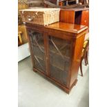 A GEORGIAN STYLE MAHOGANY SMALL BOOKCASE WITH TWO ASTRAGAL GLAZED DOORS, ON BRACKET FEET, 3'2" WIDE