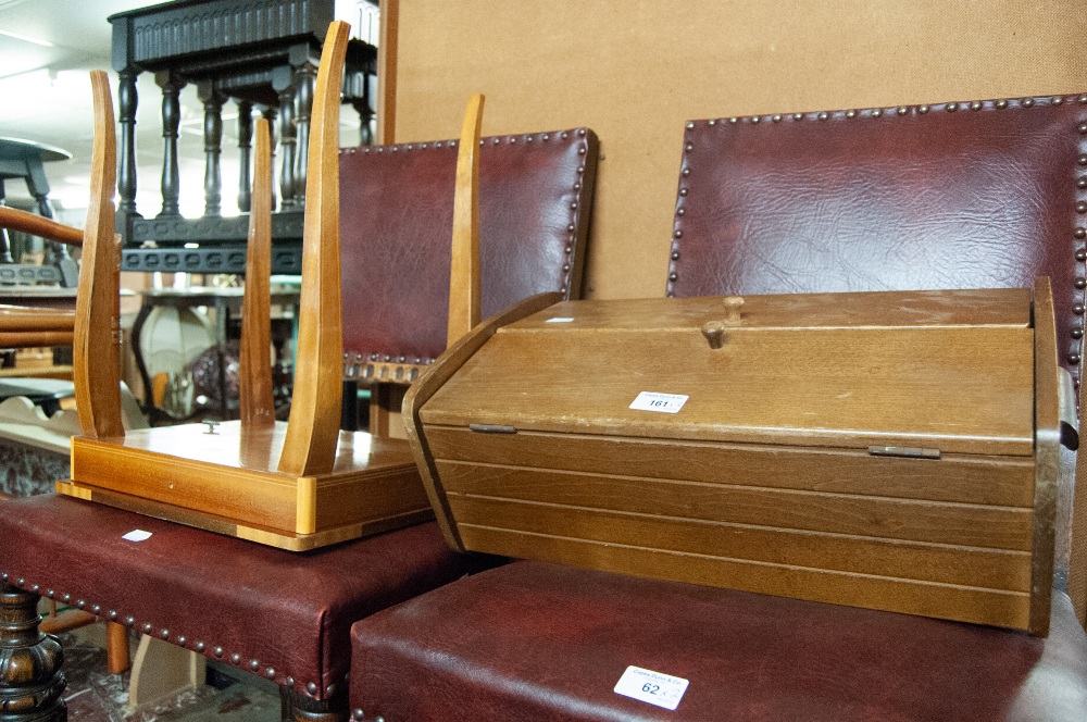 A SEWING BOX, RAISED ON SUPPORTS, AND A SMALL TABLE WITH MUSICAL FITTING