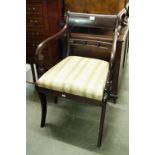 A SET OF SEVEN REGENCY STYLE MAHOGANY SABRE LEG DINING CHAIRS WITH FABRIC COVERED TRAFALGAR SEATS (6