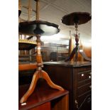 A PAIR OF MAHOGANY TRIPOD WINE TABLES; A CARVED MAHOGANY PERIODICAL RACK AND A LEATHER POUFFE (4)