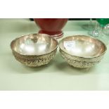 TWO SMALL FAR EASTERN CAST WHITE METAL BOWLS, double walled with openwork borders of birds amongst