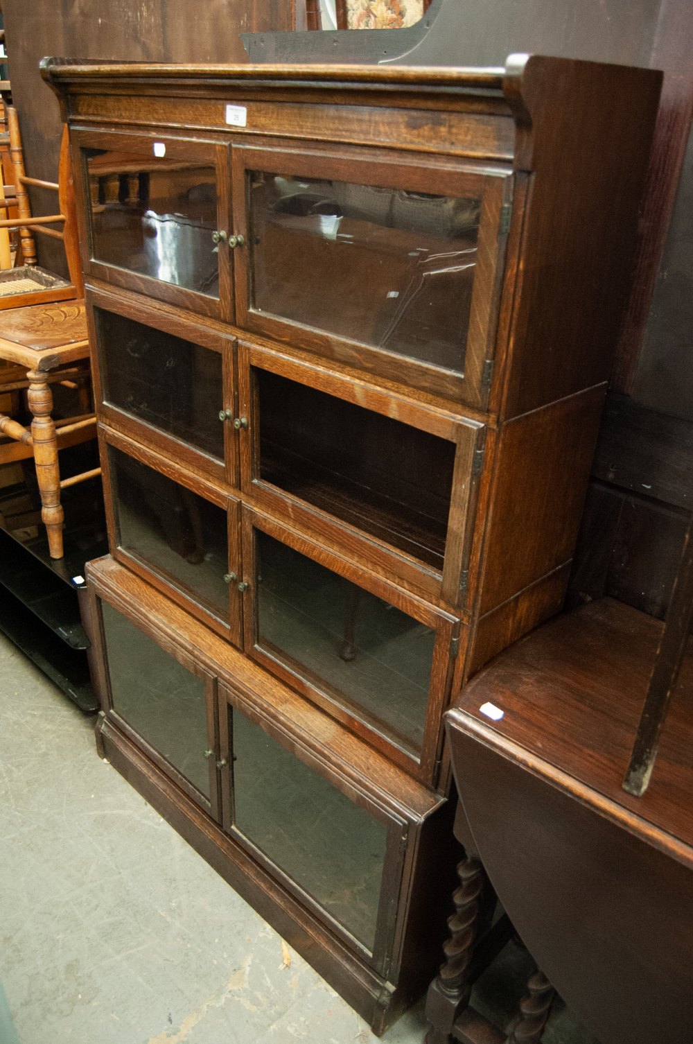 CIRCA 1920S, OAK FOUR TIER SECTIONAL BOOKCASE, EACH TIER ENCLOSED BY A PAIR OF FRAMED AND GLAZED