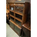 CIRCA 1920S, OAK FOUR TIER SECTIONAL BOOKCASE, EACH TIER ENCLOSED BY A PAIR OF FRAMED AND GLAZED