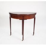 EDWARDIAN SATINWOOD CROSSBANDED MAHOGANY DEMI-LUNE FOLD-OVER CARD TABLE, standing on three square