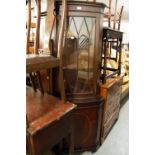 A REPRODUCTION MAHOGANY STANDING CORNER CUPBOARD