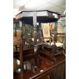 AN EARLY 20TH CENTURY MAHOGANY OCCASIONAL TABLE WITH SHAPED EDGE AND UNDERSTAGE AND A LATER TURNED