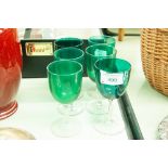 SIX LATE VICTORIAN PORT GLASSES WITH GREEN BOWLS, PLAIN DRAWN STEMS AND CUSHION KNOPS AND CIRCULAR