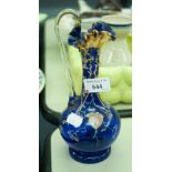 NINETEENTH CENTURY BLUE GLASS EWER WITH ENAMELLED FLOWERS