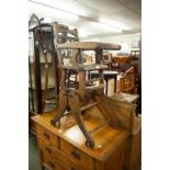 AN EARLY TWENTIETH CENTURY CHILD'S METAMORPHIC HIGH CHAIR WITH CAST METAL WHEEL