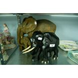 EBONY ELEPHANT FIGURINE WITH IVORY TUSKS AND DETAIL AND A RESIN ELEPHANT FIGURE GROUP (2)