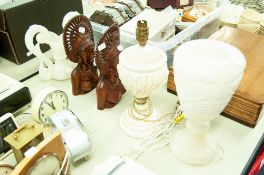 A WHITE ONYX URN AS A TABLE LAMP, A PAIR OF HARDWOOD SOUTH SEAS (BALI) FEMALE HEADS AND A TABLE LAMP