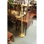 A BRASS STANDARD LAMP, SILK SHADE OVER SQUAT BRASS BALL SPACER COLUMN, ON SPREAD BASE