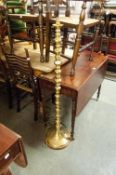 A BRASS STANDARD LAMP, SILK SHADE OVER SQUAT BRASS BALL SPACER COLUMN, ON SPREAD BASE