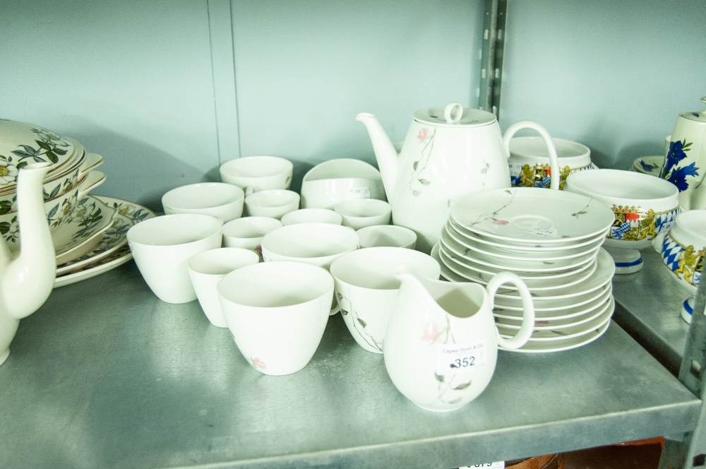 A GERMAN TEA SERVICE 'QUINCE' PATTERN, FOR SIX PERSONS AND A SET OF FOUR WEST GERMAN SOUP BOWLS ON