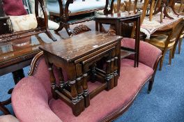 MODERN REPRODUCTION NEST OF THREE TABLES, with flame cut mahogany tops, ANOTHER IN OAK, AND TWO PART