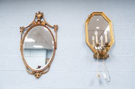 REGENCY STYLE OVAL WALL MIRROR WITH BEVEL EDGED PLATE, and ribbon tied bellflower pendant and
