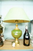 A MODERN TABLE LAMP HAVING GILT STAND WITH GLASS BALLOON STRIPED INSERT WITH GREEN SILK SHADE