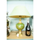 A MODERN TABLE LAMP HAVING GILT STAND WITH GLASS BALLOON STRIPED INSERT WITH GREEN SILK SHADE
