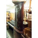 A MAHOGANY DOUBLE CORNER CUPBOARD WITH BOW FRONT