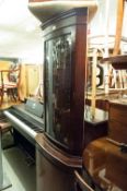 A MAHOGANY DOUBLE CORNER CUPBOARD WITH BOW FRONT