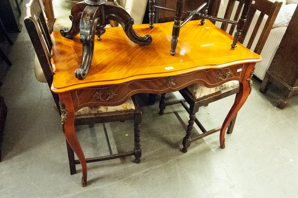 A REPRODUCTION OF FRENCH WRITING TABLE, WITH SHAPED TOP OVER SINGLE DRAWERS, ALL RAISED ON