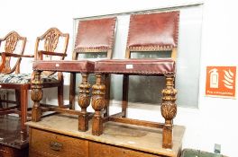 A PAIR OF OAK REPRODUCTION DINING CHAIRS, PAD BACK AND SEAT WITH STUD DETAIL AND CUP AND COVER