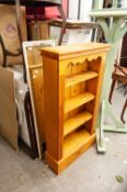 PINE BOOKCASE, HAVING FOUR SHELVES AND THREE VARIOUS WALL MIRRORS